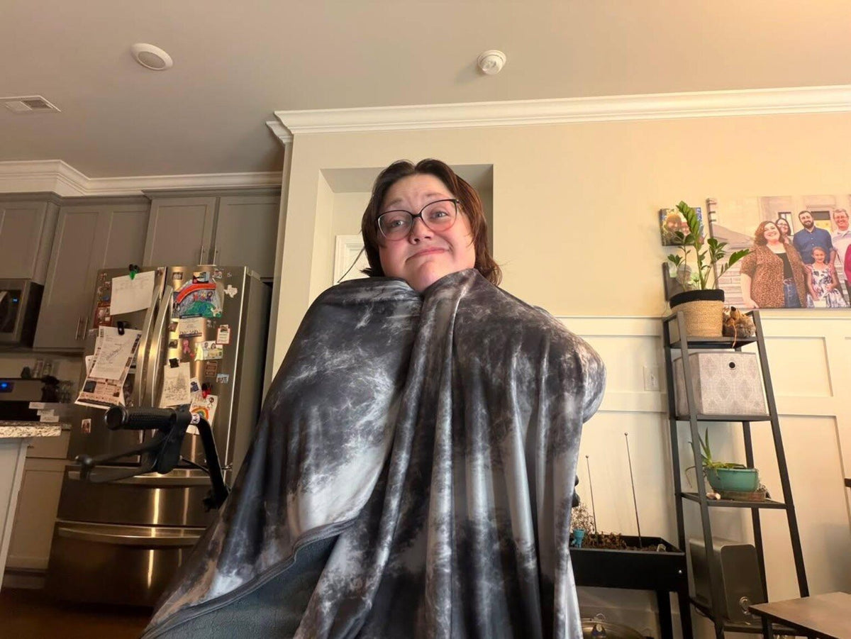 Customer Chelsea enjoying the soft gray IceBlankie CoolSleep Cooling Blanket