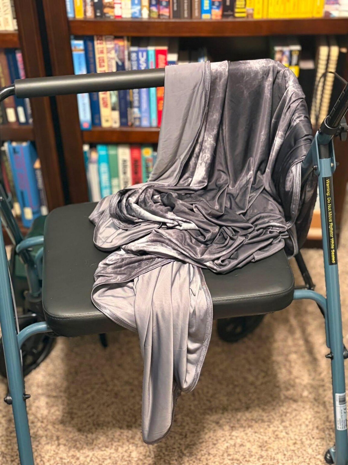 Real-life view of the gray IceBlankie CoolSleep Cooling Blanket showing its two-sided fabric